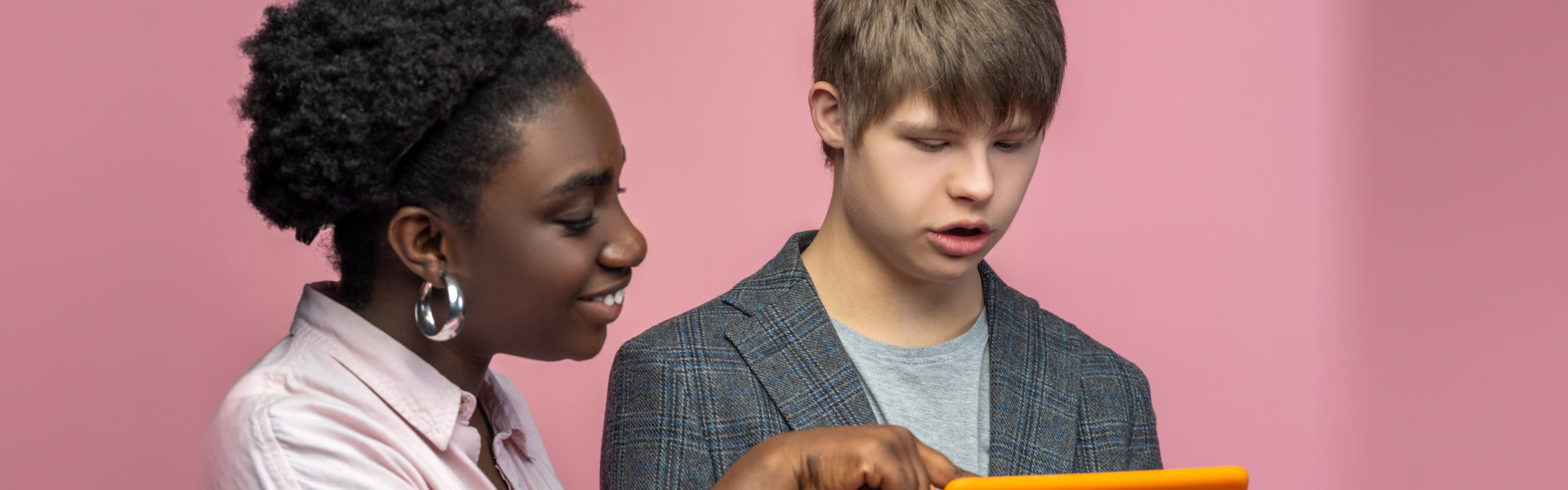 Woman teaching a boy